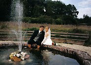 Bride and groom on the fountain of Steprath Mansion